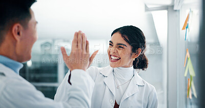 Buy stock photo Lab, scientist and people with medical research, high five and colleagues with sticky notes or happy. Celebration, teamwork and employees with gesture for success, healthcare or achievement in clinic