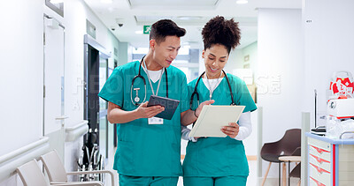 Buy stock photo Doctors, man and woman in hallway with tablet, documents and smile for results, report and feedback. People, team and happy with digital touchscreen, app and review with medical solution at hospital