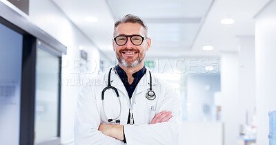 Buy stock photo Doctor, man and happy with arms crossed at clinic for medical support, healthcare treatment or career confidence. Portrait, cardiology and mature person for health, about us and hospital management