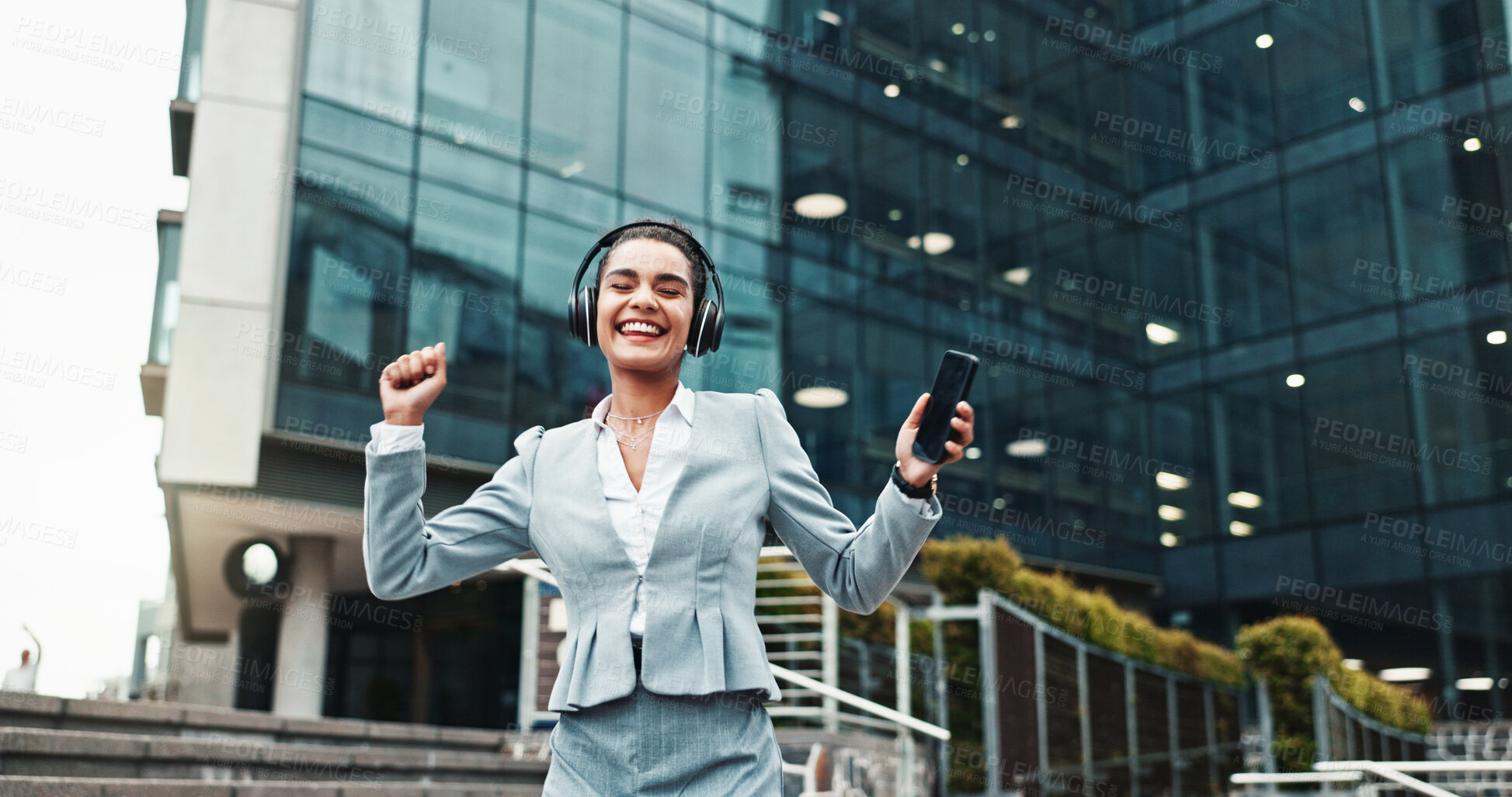Buy stock photo Business, headphones and woman in city, celebration and smile with audio, listening to music and success. Happy person, dance and consultant with cellphone, promotion and headset with sound or radio