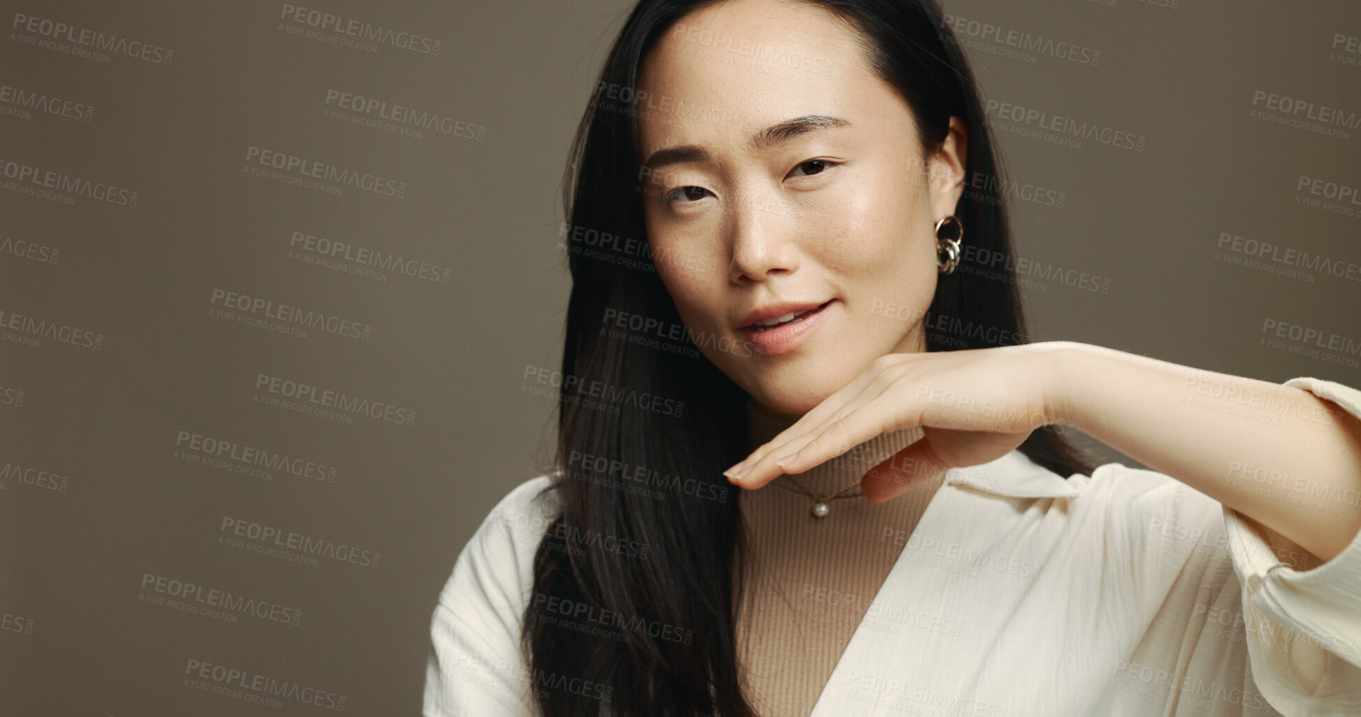 Buy stock photo Skincare, beauty and portrait of Asian woman in studio with cosmetic, natural and facial with mockup. Glow, space and female person with face dermatology treatment for hydration by brown background.