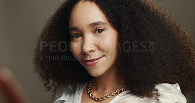 Buy stock photo Woman, portrait and selfie in studio with beauty, natural cosmetics and smile. Influencer, confident and POV on gray background for photography, social media engagement and makeup tutorial results