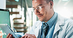 Scientist, happy or man with tablet in laboratory for medical innovation, treatment development or clinical trial. Biotechnology, science expert or digital app for research, experiment report or data