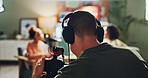 Content creation, podcast and streaming with director in studio for videography or live broadcast on air. Camera, interview and recording with people on production set for creative collaboration