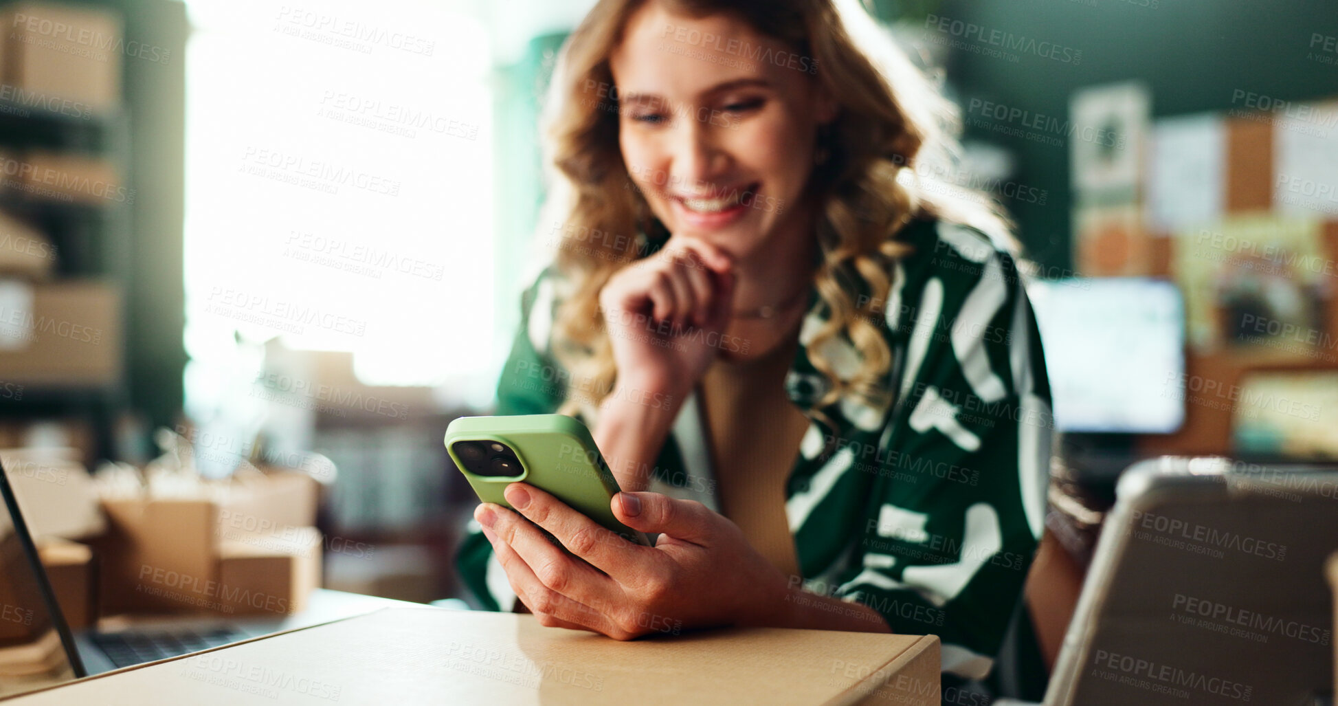 Buy stock photo Boxes, logistics and phone with woman in office for delivery or shipping communication and schedule. Hands, laptop and supply chain with happy person in depot or warehouse for ecommerce tracking