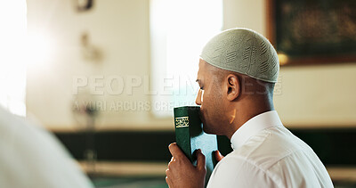 Buy stock photo Kiss, man and Quran in mosque for Muslim faith, studying and spiritual help for worship or praise Allah. Islamic, love or person with holy book for guidance, learning scripture and prayer in temple