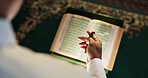 Muslim person, Quran or hands with beads in mosque for Palestine, gratitude or support to Allah in holy temple. Above, Islamic and reading book for spiritual guidance, learning and Ramadan Kareem