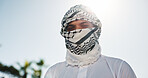 Portrait, Muslim and man with religion, outdoor and covering face with keffiyeh, belief and worship. Islamic faith, spiritual and person with thobe for prayer, scarf and respect for Allah or holy