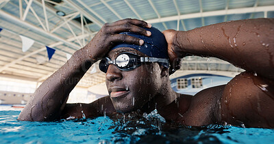 Buy stock photo Swimming, fitness and man in pool, water and practice for competition, healthy or routine in morning. Swimmer, athlete and black person with goggles for performance, exercise or preparation for sport