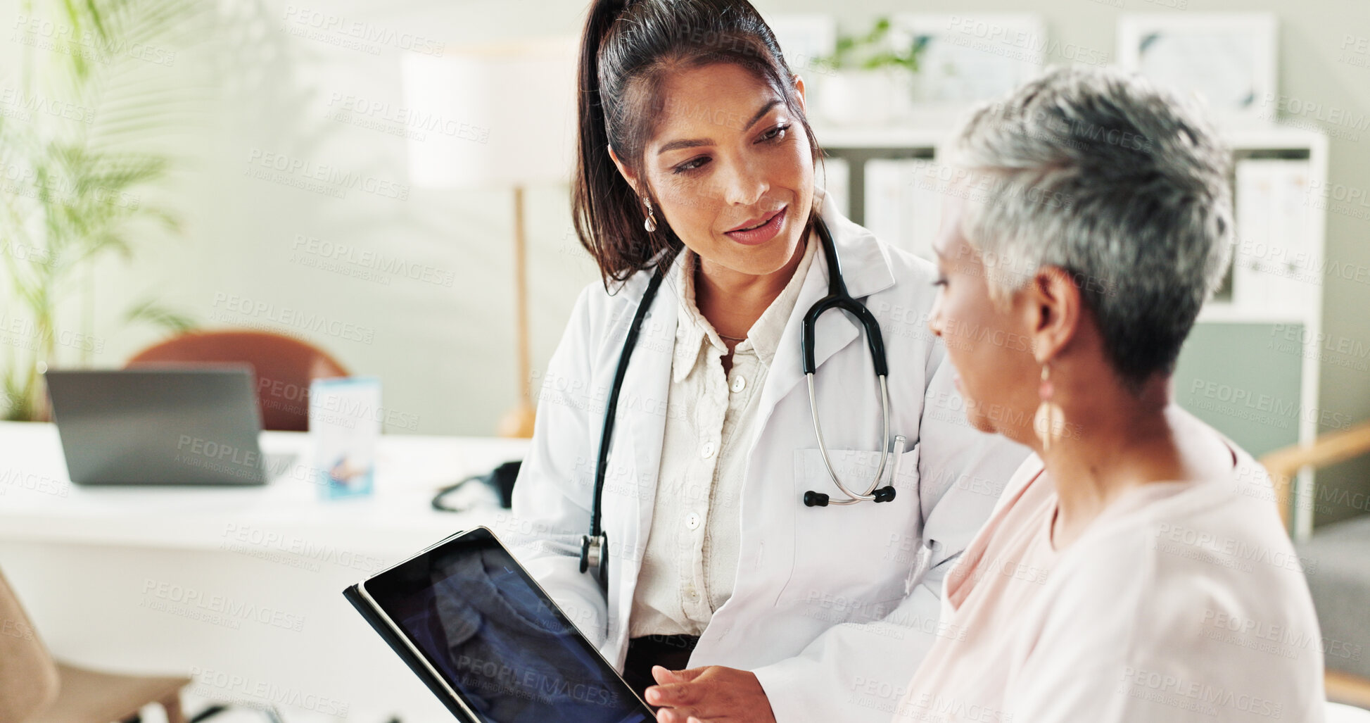 Buy stock photo Doctor, senior woman and tablet for x ray results, lungs assessment and medical exam at hospital. Radiologist, elderly patient and online for chest scan, diagnosis and advice for healthcare treatment