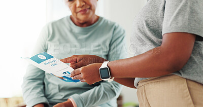 Buy stock photo Clinic, patient and caregiver with brochure for consultation, diagnosis information or healthcare service. Hands, medical consultant or senior woman with pamphlet for advice, recovery tips or support