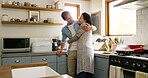 Hug, couple and bonding in kitchen, smile and romance for people in house, relationship and commitment. Break, woman and embrace with man in apartment, happiness and affection for lover in home