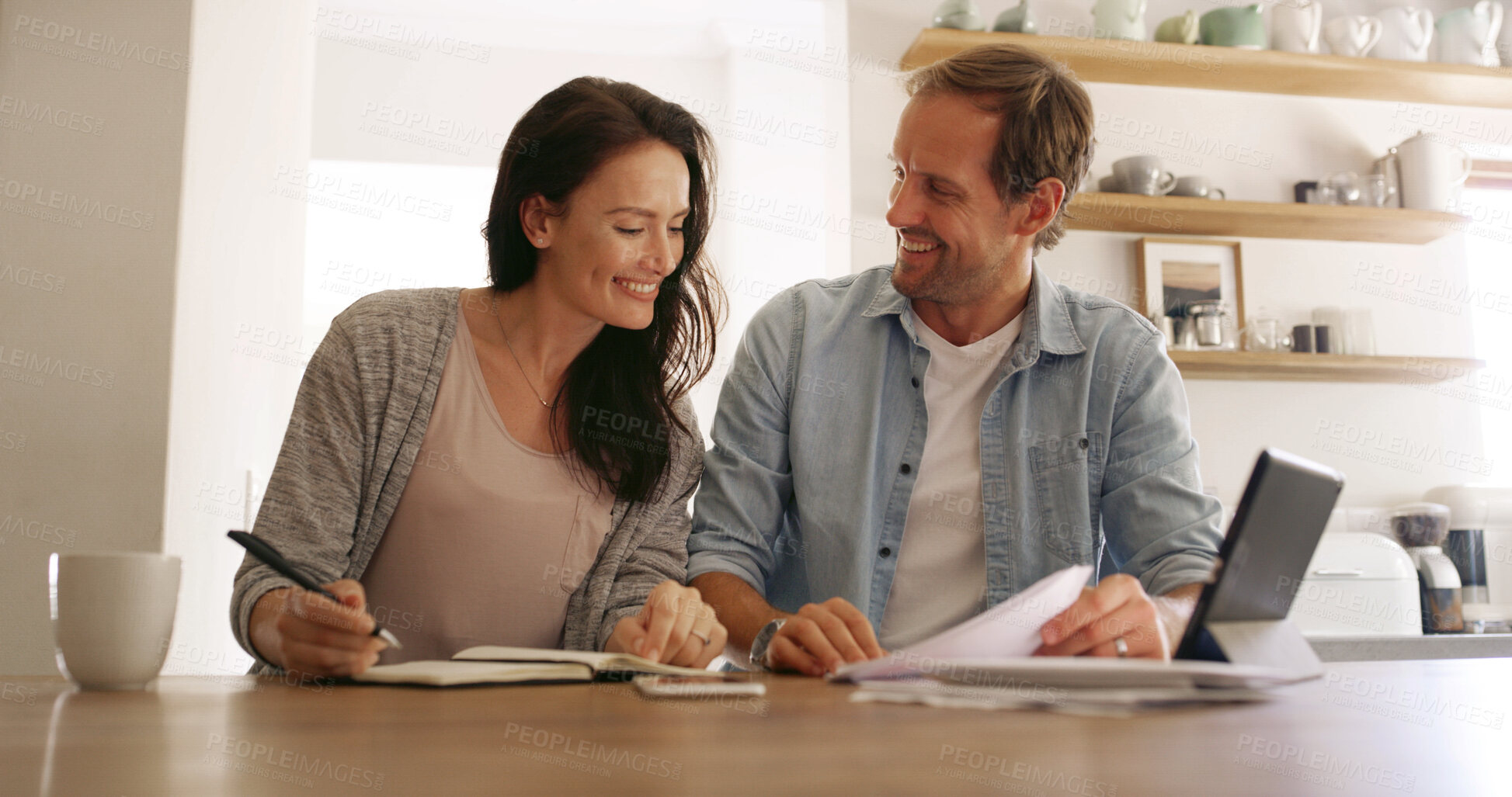 Buy stock photo Home, documents and couple with smile, finance and payment for mortgage, tablet and conversation Apartment, banking and man with woman in kitchen, investment and discussion with savings growth