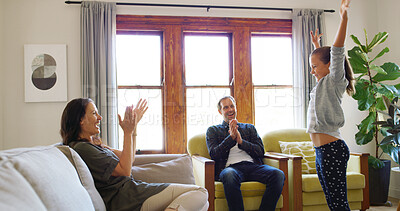 Buy stock photo Home, child and parents clapping for performance, talent or acting rehearsal for family or creativity. Happy, energy or girl in lounge with support, mom or dad for solo act, applause or encouragement