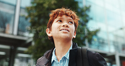 Buy stock photo Outdoor, child and student with backpack for school, education and studying opportunity with thinking. Campus, happy boy and walking with thoughts for elementary, learning academy and learner outside