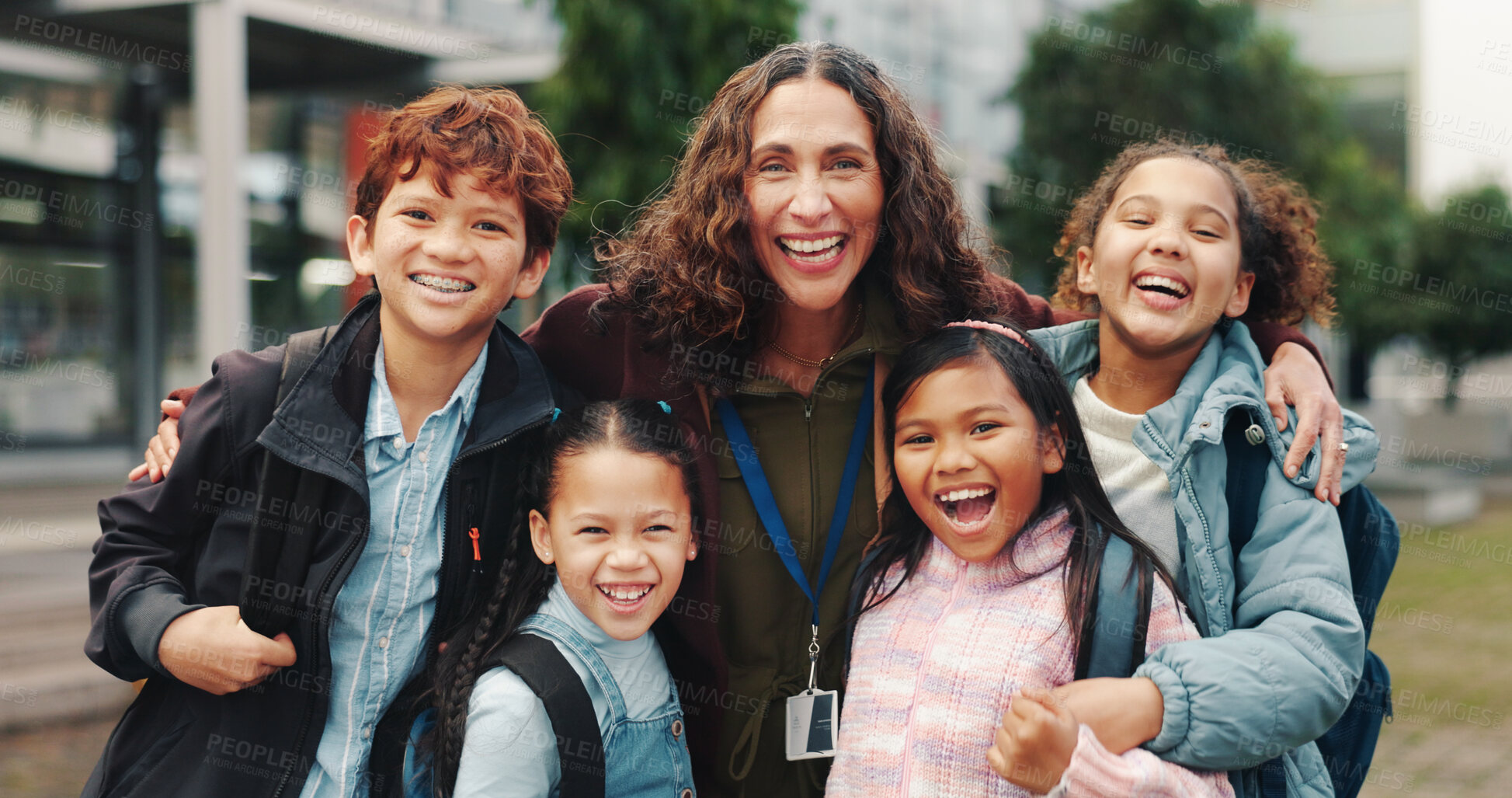 Buy stock photo Children, hug and smile with teacher, outdoor and reunion in city for solidarity, connection or portrait. School kids, group and woman with embrace, education and welcome for scholarship at academy