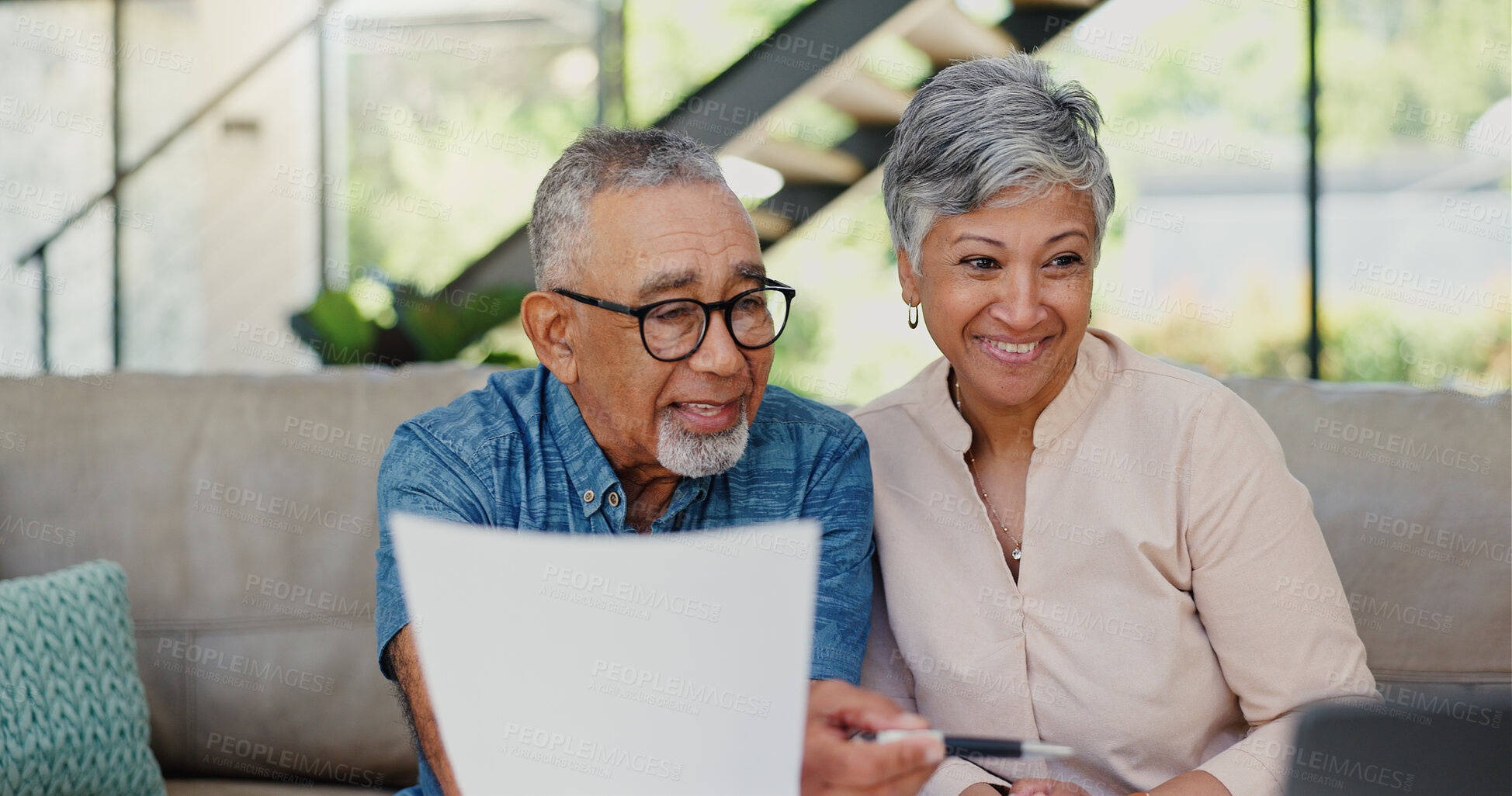 Buy stock photo Happy, documents and senior couple on sofa in discussion for debt, mortgage or bills payment completed. Excited, laptop and elderly man with woman for retirement funds plan with investment in home