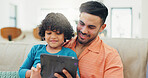 Father, boy and tablet on sofa, happy and scroll with choice for film, movie and relax in living room. Dad, child and smile with touchscreen on app, streaming or subscription with game in family home
