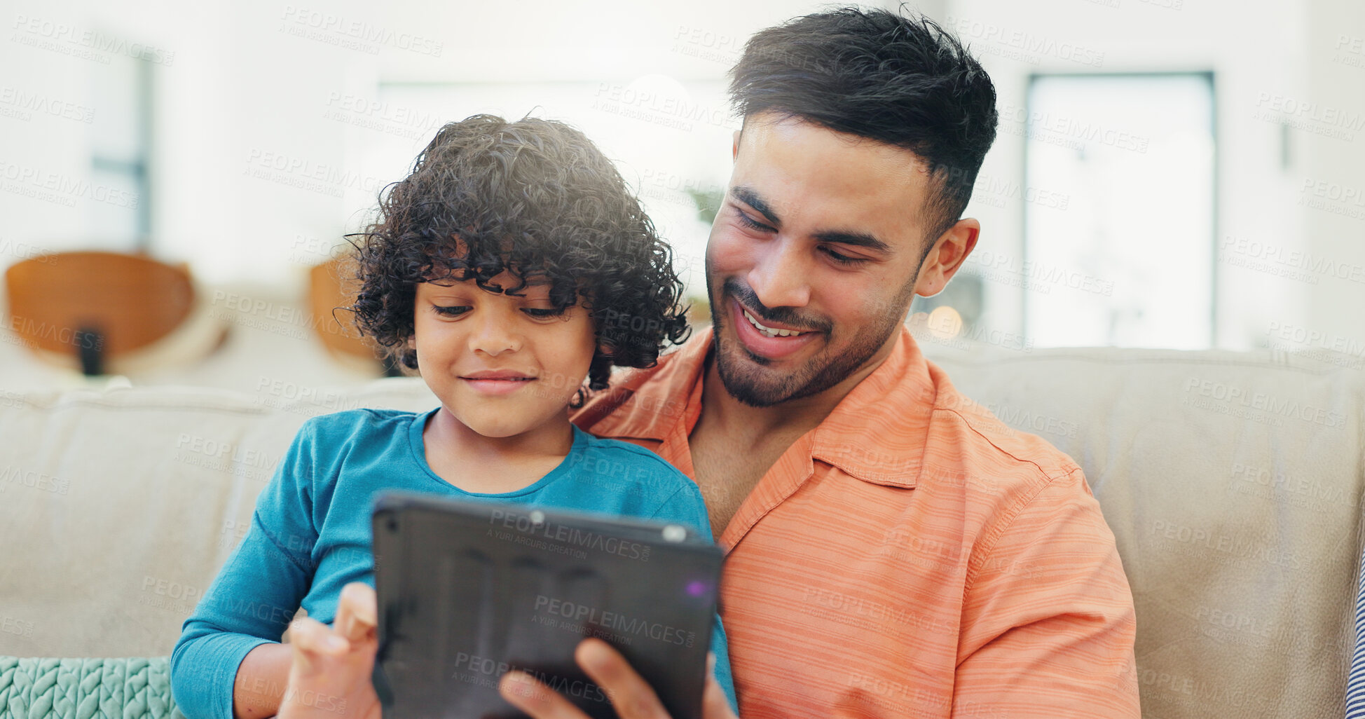 Buy stock photo Father, boy and tablet on sofa, happy and scroll with choice for film, movie and relax in living room. Dad, child and smile with touchscreen on app, streaming or subscription with game in family home