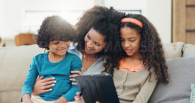 Buy stock photo Sofa, mother and children with tablet for games, streaming online and bonding together on weekend. Family home, boy and mom with girl for digital ebook, cartoon website and smile on couch in lounge