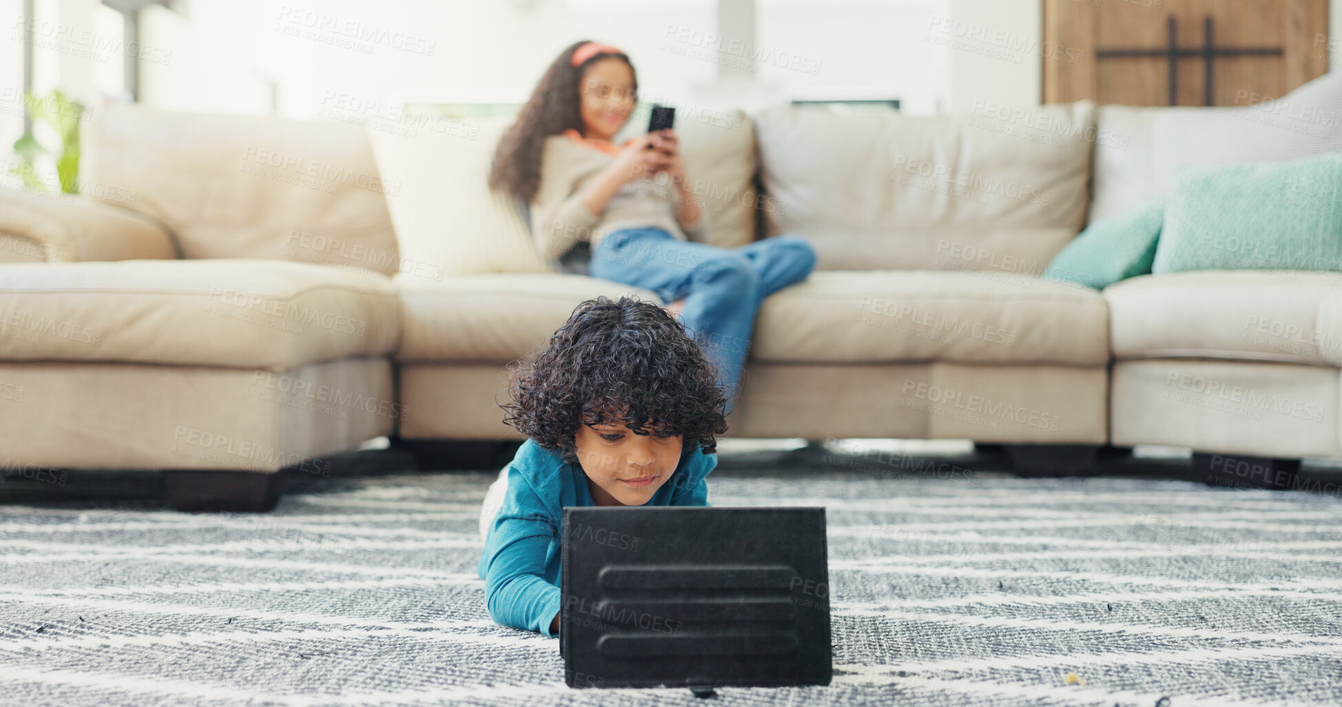 Buy stock photo Relax, streaming and tablet with boy on floor in living room of home for break or education. App, games or watching video and brother in apartment for distance learning or remote study with sister