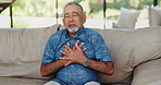 Senior man, stress and chest pain with heart attack on sofa for health fail, artery pressure and medical emergency. Cardiovascular, elderly person or discomfort with cardiac arrest and danger in home