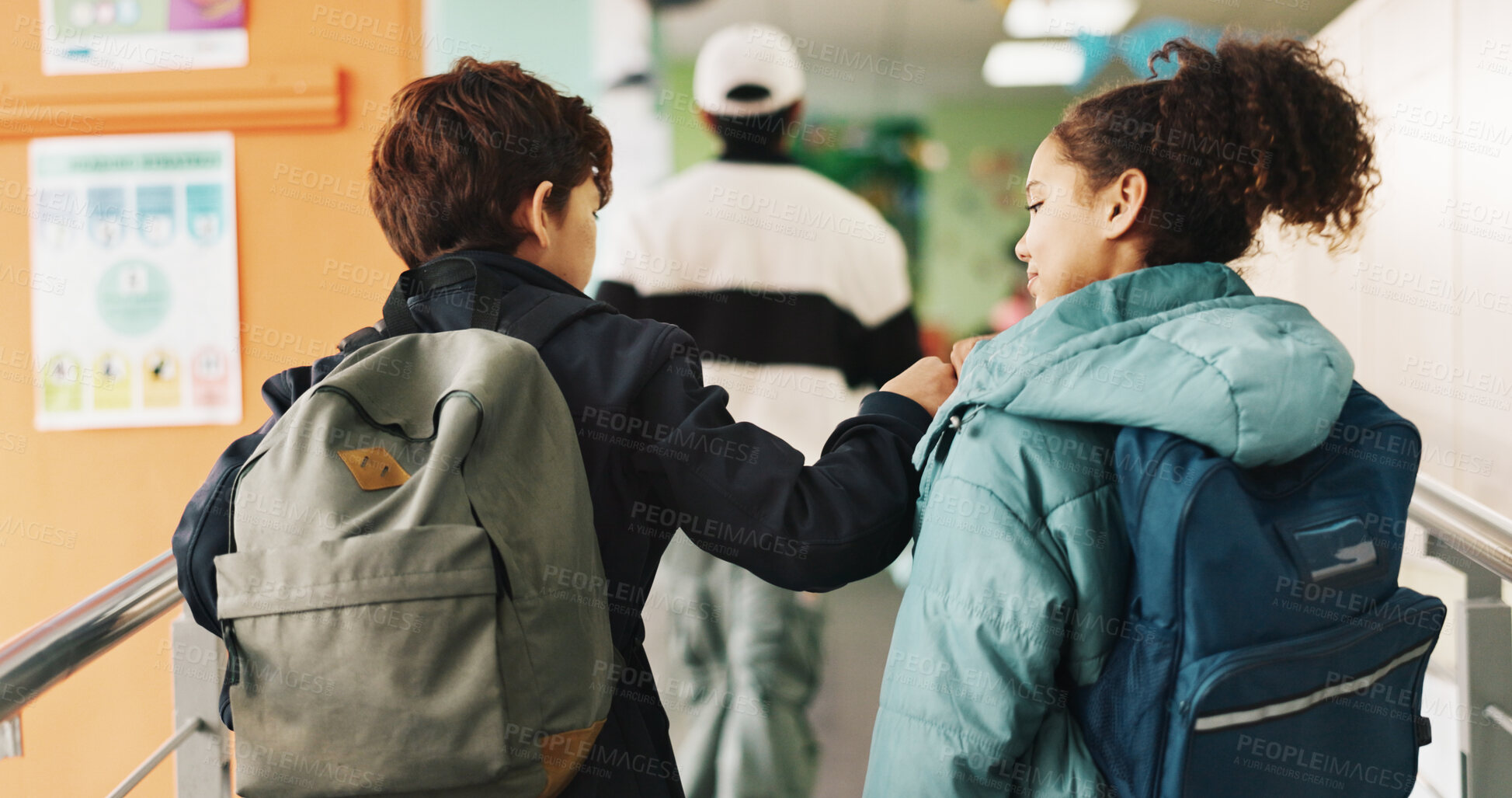 Buy stock photo Back, fist bump and friends in school corridor together for education, learning or study. Children, development or walking with boy and girl students in hallway for lesson, knowledge or scholarship