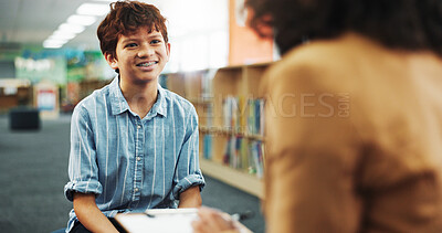 Buy stock photo Talking, library and kid with school counsellor for future, development or career assessment. Discussion, education and therapist with boy student for behavior analysis at campus for growth.