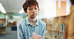 Children, counseling or listening with boy and therapist in library of school for assessment or review. Development, education and occupational therapy with student speaking to counselor for support