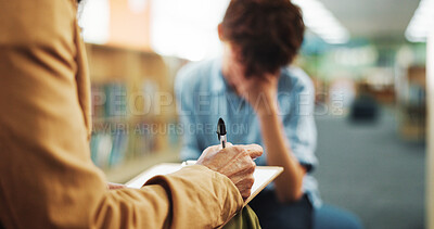 Buy stock photo Counseling, hand or writing with child and therapist in library of school for assessment or review. Education, feedback and occupational therapy with student speaking to counselor for support