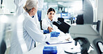 People, scientist and tube for test in lab of medical, research, dna discovery and vaccine solution. Team, researcher and chemistry with gene particles for investigation, healthcare medicine and cure