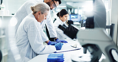 Buy stock photo People, scientist and writing notes in lab for checklist, results report and medical discovery of vaccine. Team, researcher and information of dna research, experiment update and healthcare solution 