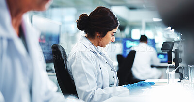 Buy stock photo Woman, scientist and typing in lab for research, information and results for medical discovery. Person, science and feedback on experiment for biotechnology, assessment report and healthcare solution