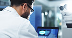 Man, scientist and laptop with forensic research for scientific discovery or new medicine at lab. Male person, science and clinic trial with technology for medical test, exam or results at laboratory