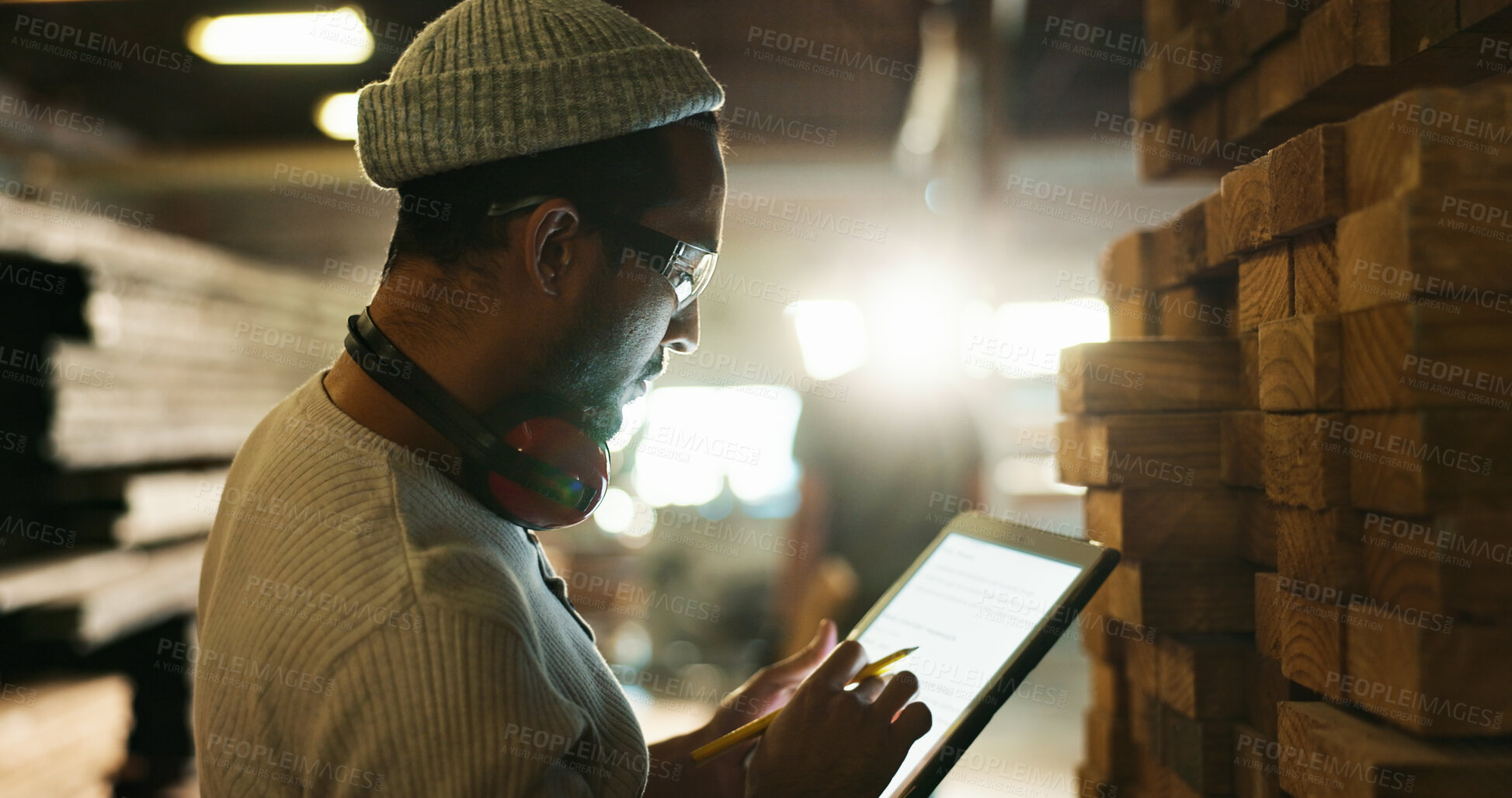 Buy stock photo Carpenter, tablet or stock inspection in factory for inventory check, wood quality control or material count. Manufacturing, man or digital screen for timber management, backlog evaluation or storage