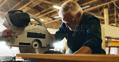 Buy stock photo Carpenter, man and machine with wood in workshop, diy manufacturing and production business. Factory, mature person and contractor with saw tools for furniture service, maintenance and cutting plank