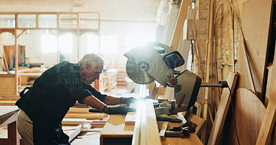Buy stock photo Workshop, man and machine with plank for carpenter, diy manufacturing and production business. Warehouse, mature person and contractor with saw tools for professional service, maintenance or cut wood