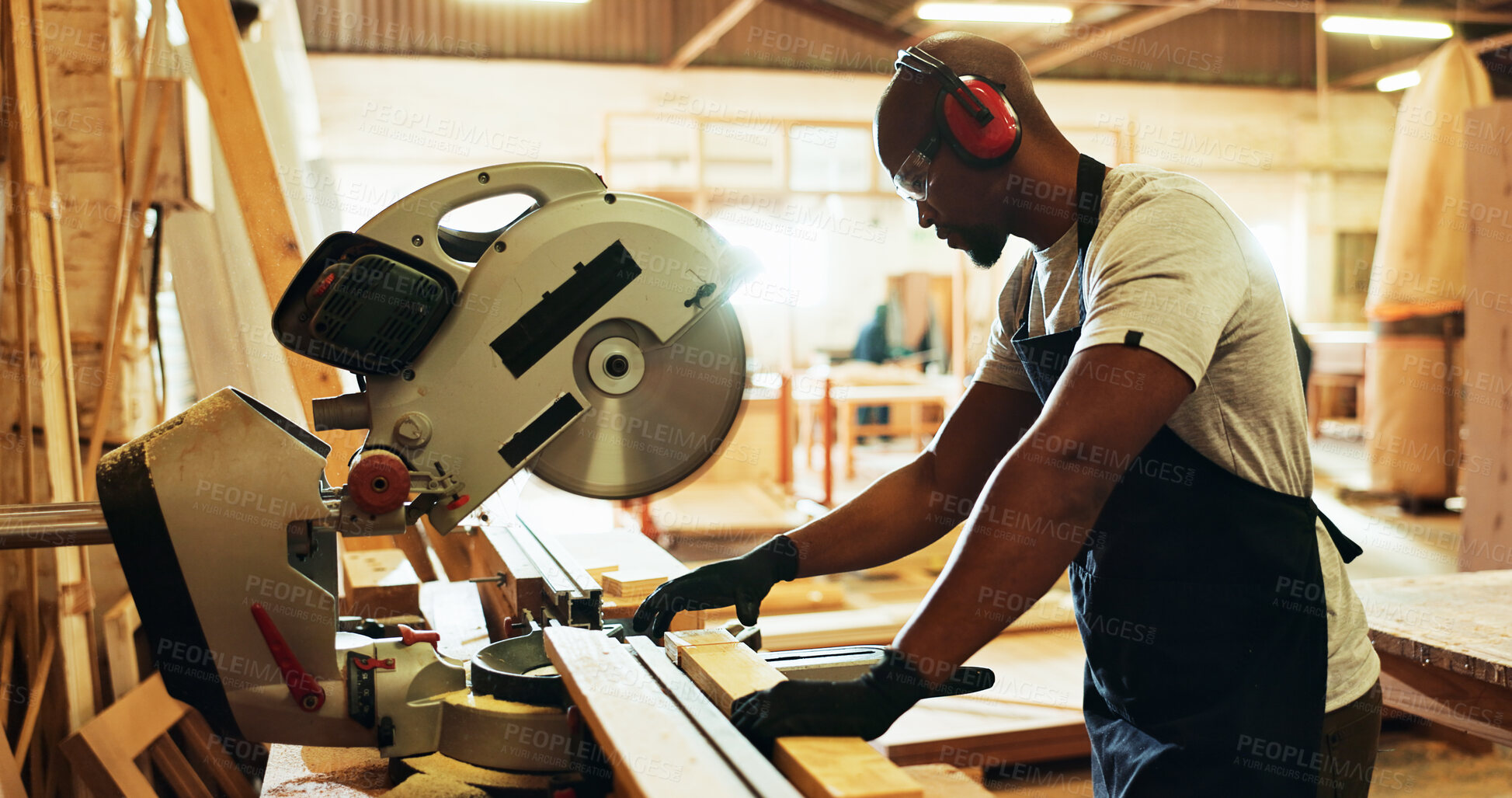 Buy stock photo Carpenter, black man and machine with wood in workshop, diy manufacturing and production business. Factory, male person and contractor with saw tools for furniture service, maintenance and cut plank