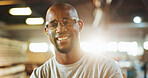 Workshop, black man and happy in portrait for carpenter, wood manufacturing and production business. Confidence, contractor and male person with glasses for safety, maintenance and plank renovation