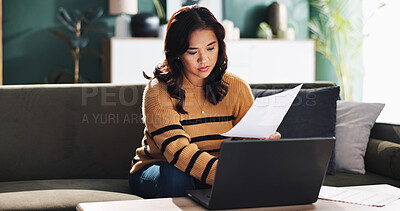 Buy stock photo Asian woman, laptop and sofa with documents for finance, budget planning or debt review at home. Female person, computer or paperwork with invoices for financial report, bills or expenses at house