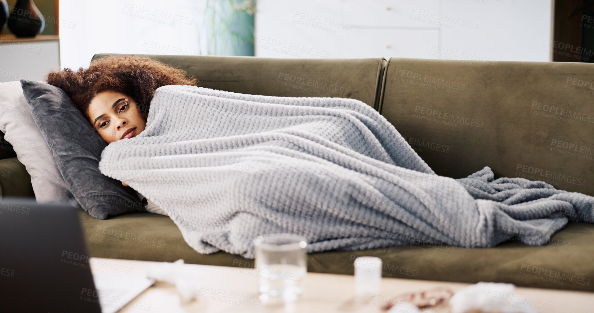 Buy stock photo Laptop, sick and relax with woman on sofa for medical recovery, streaming and flu season. Disease, subscription and fever with female person and blanket in living room at home for virus outbreak
