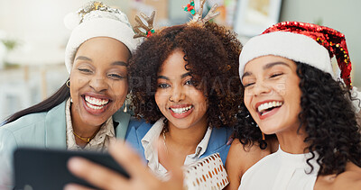 Buy stock photo Woman, friends and selfie in office at Christmas, party and happy with post on social media with Santa hat. People, group and smile with photography, celebration and festive event with xmas cheers