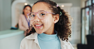 Buy stock photo Optometry portrait, kid and shopping for glasses in retail store for prescription lens, optical correction and eye care. Frame fitting, girl child and happy with designer spectacles or eyewear choice