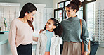 Family, optometry or vision with girl and woman in hospital for appointment, checkup and eye care. Eyewear, glasses or prescription with child and optometrist in clinic for ophthalmology consulting
