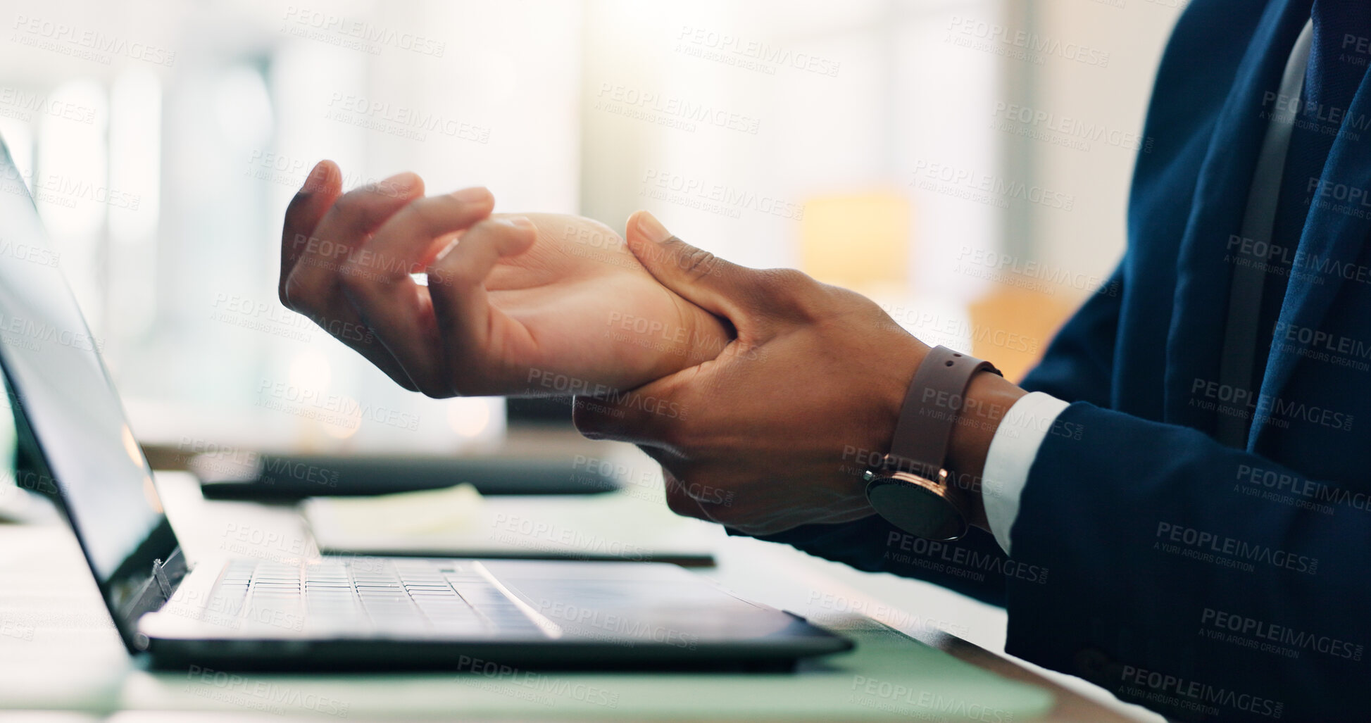 Buy stock photo Business person, hands and laptop with wrist injury for carpel tunnel, bruise or overworked at office desk. Closeup, employee or muscle tension with fibromyalgia for joint inflammation, strain or ache