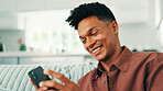 Online dating, funny and man with phone in home for social media application, subscription or search. Sign up, meme or happy person laughing with mobile message on sofa for post, chat or news website