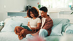 Tablet, happy and couple in living room in home with planning romantic vacation, holiday or getaway. Relax, digital technology and man with woman for booking flights for honeymoon trip in apartment.