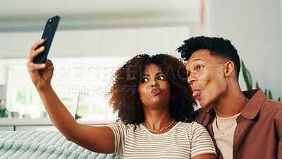 Buy stock photo Funny face, relax and selfie with couple on sofa in living room of home together for memories. Love, photograph and tongue out with people in apartment for social media or profile picture update