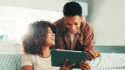 Buy stock photo Show tablet, couple and funny at home with internet, online joke and browsing for meme. Man, woman and living room sofa for social media, comedy or subscription package for entertainment in house