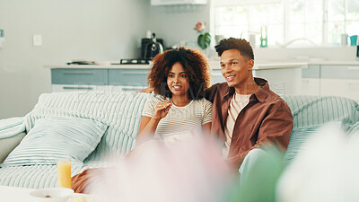 Buy stock photo Couple, watching tv and talking at home with movies, series and affection. Man, woman and living room sofa for bonding, streaming online or snacks with subscription package for entertainment in house